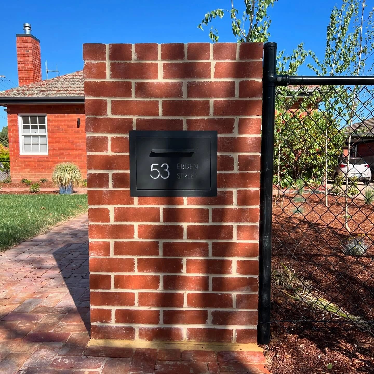 Custom brick mailbox built by Brick Projects